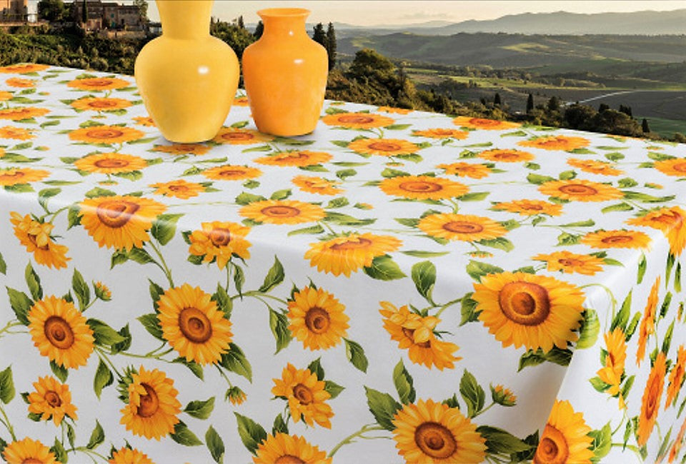 Solsikker - Voksdug i gule og orange farver på hvid bund, 160 cm bred