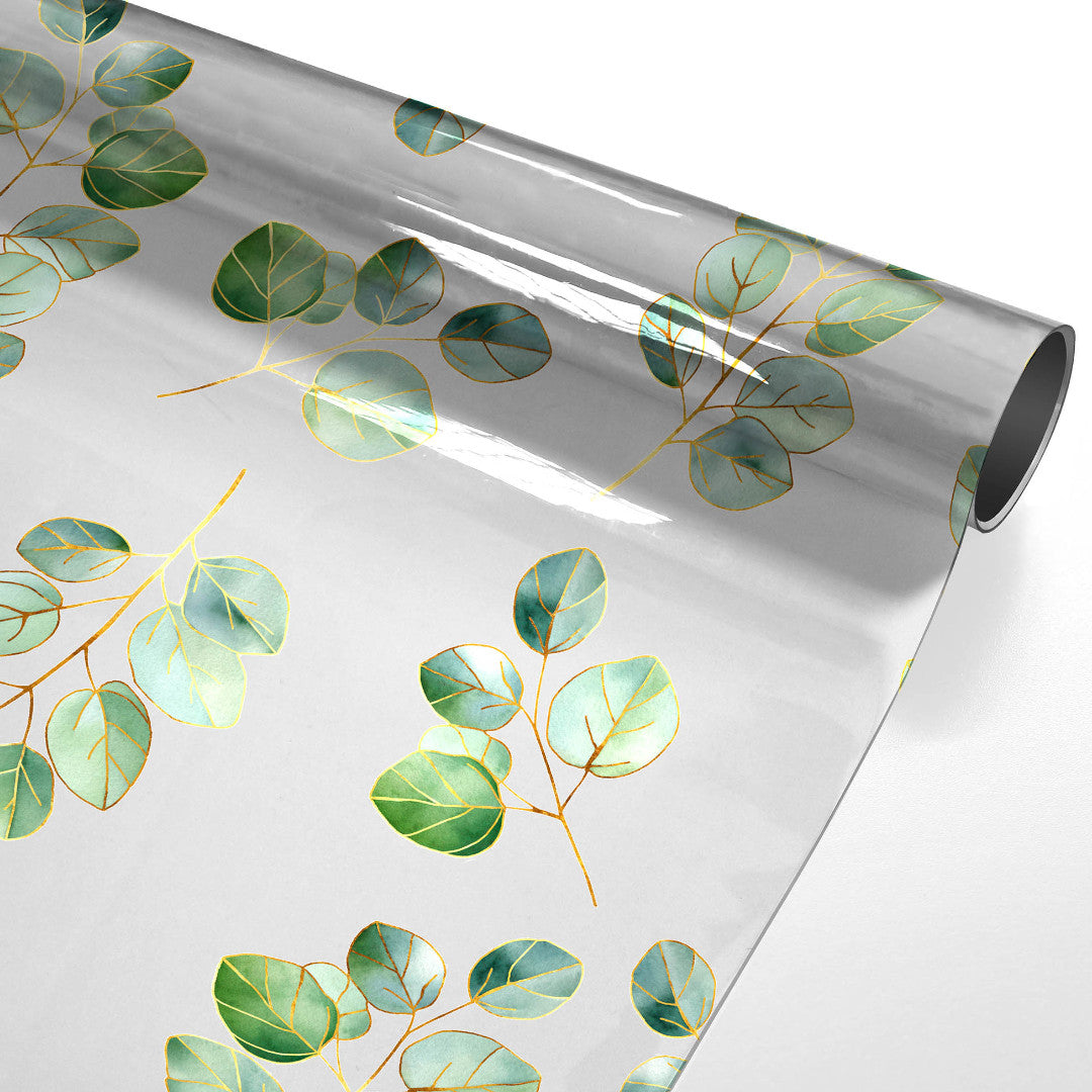 Eucalys – Gennemsigtig voksdug med gyldent bladprint, rullet