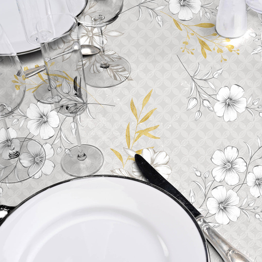 Hortense - Voksdug med floralt mønster i gyldne og neutrale toner, nærbillede