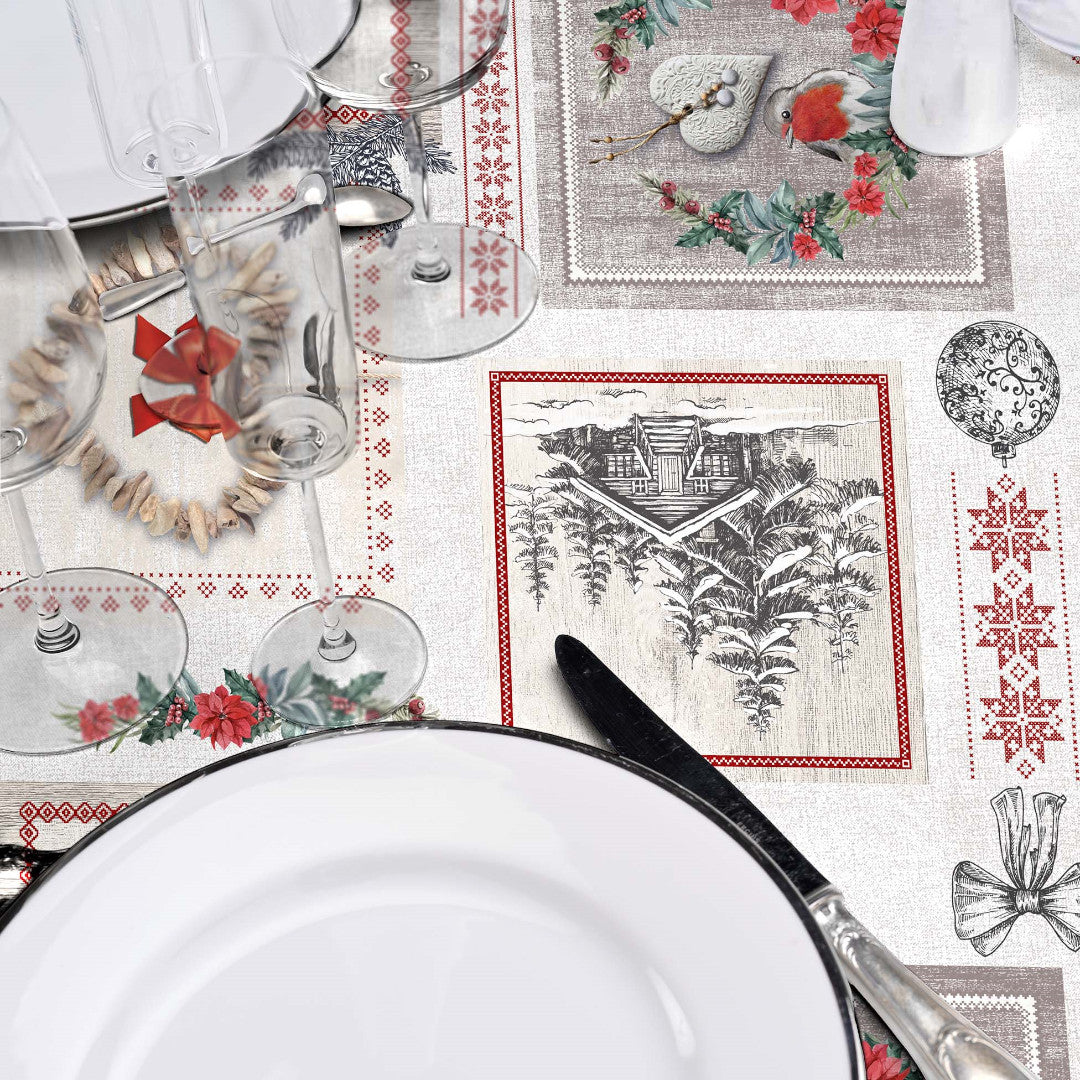 Nærbillede af opdækning med julevoksdug og bjergmotiver