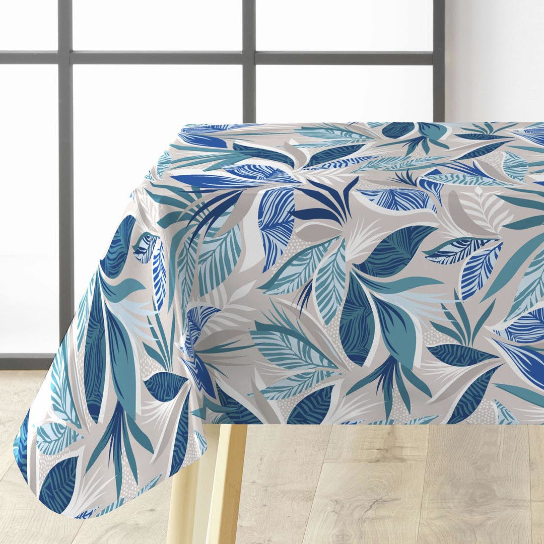 Funky Blue Jungle voksdug med blå blade på bord.