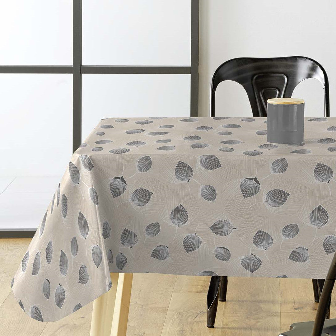 Helga Grå voksdug på bord med spændende bladmønster og lys grå/beige bund