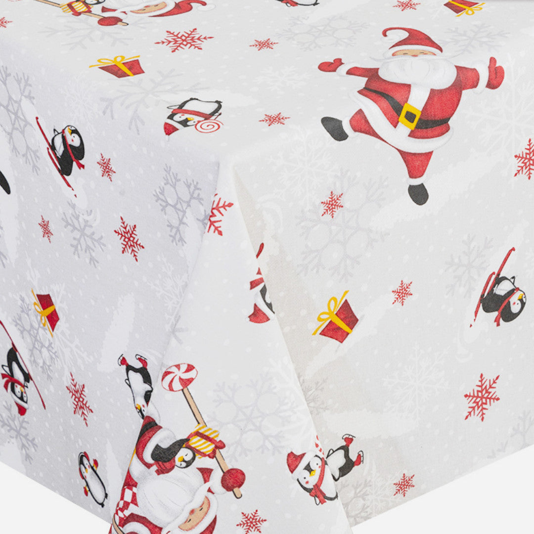 Hjørne af Julefest på Sydpolen juledug med glade julemænd og kristtjørn