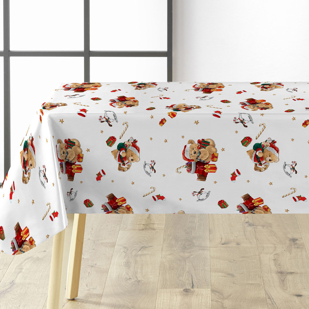 Julevoksdug med bamser og gaver på bordet