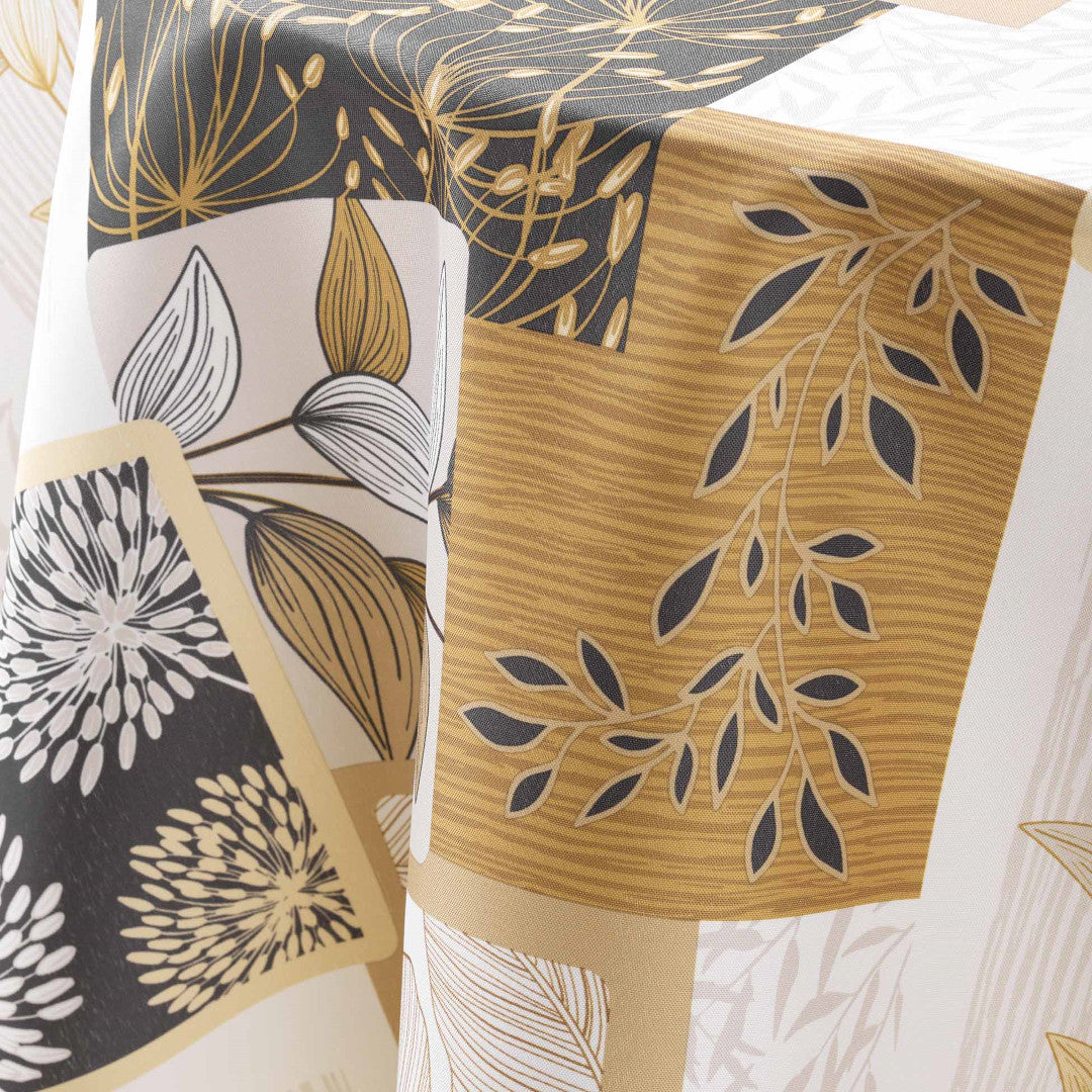 Nærbillede af dug med bladmotiver i beige