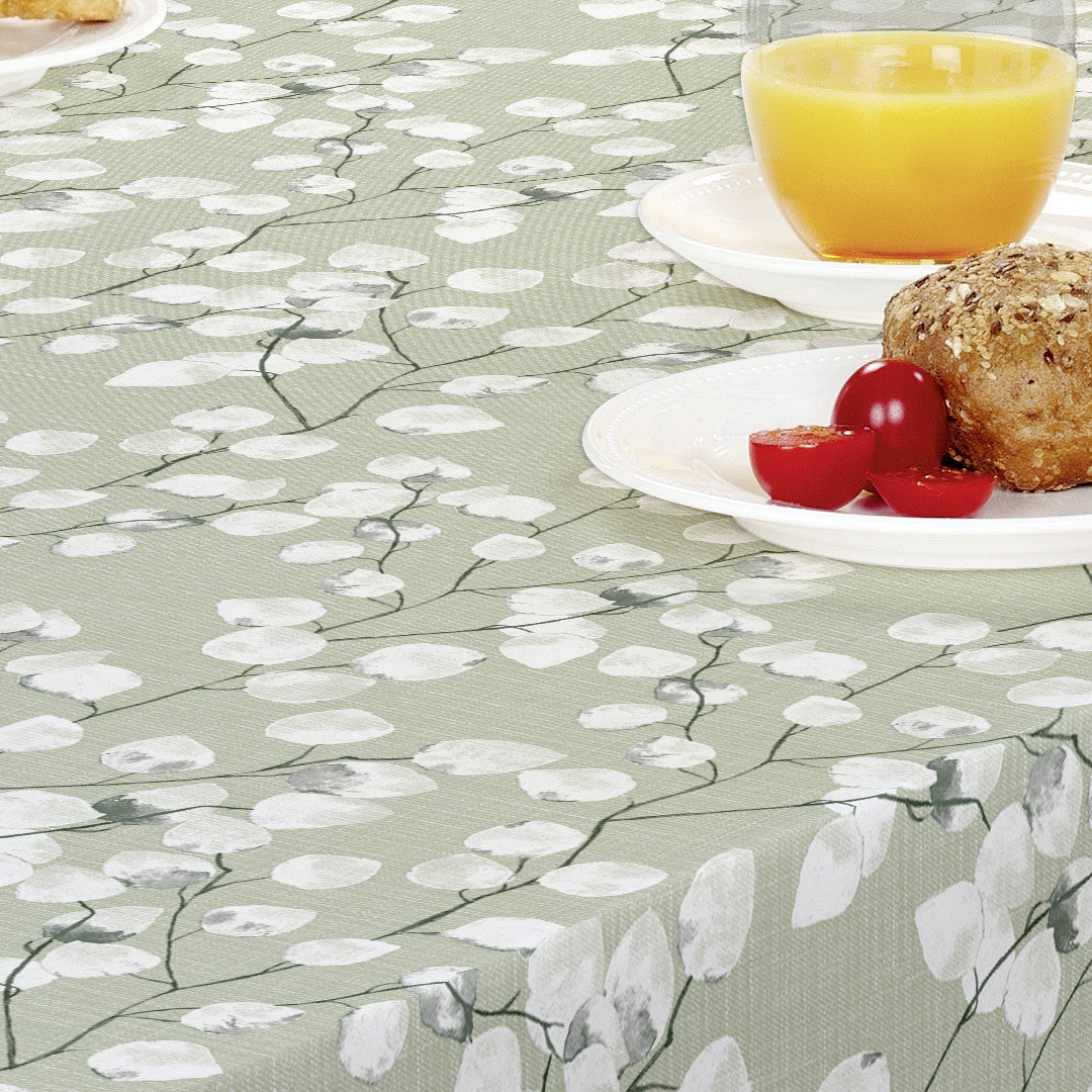 Nærbillede af Nova Green voksdug med hvide blade på lysegrøn baggrund