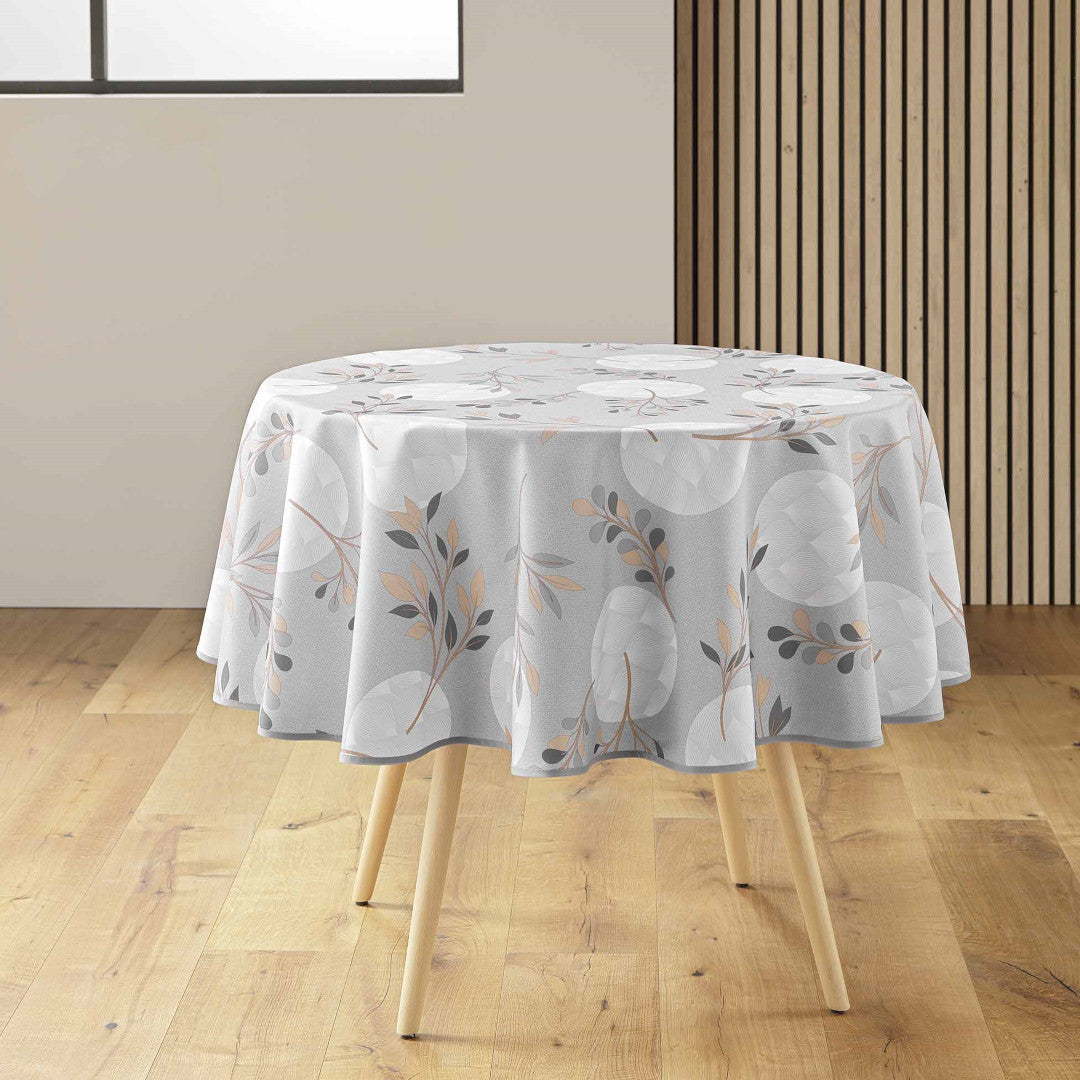 Rund grå dug dekoreret med bladmønster