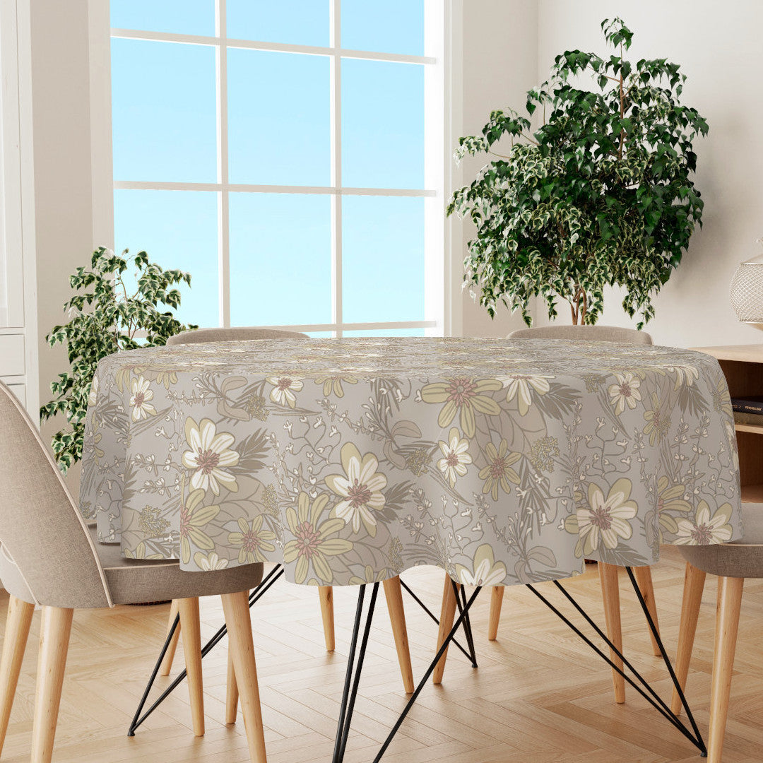 Rund voksdug med blomster og blade i pastelfarver