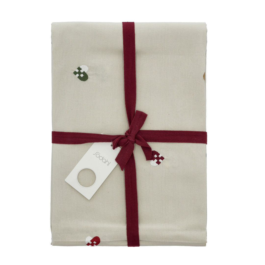 Södahl juledug pakket med rødt bånd og flettede julehjerter 140x220
