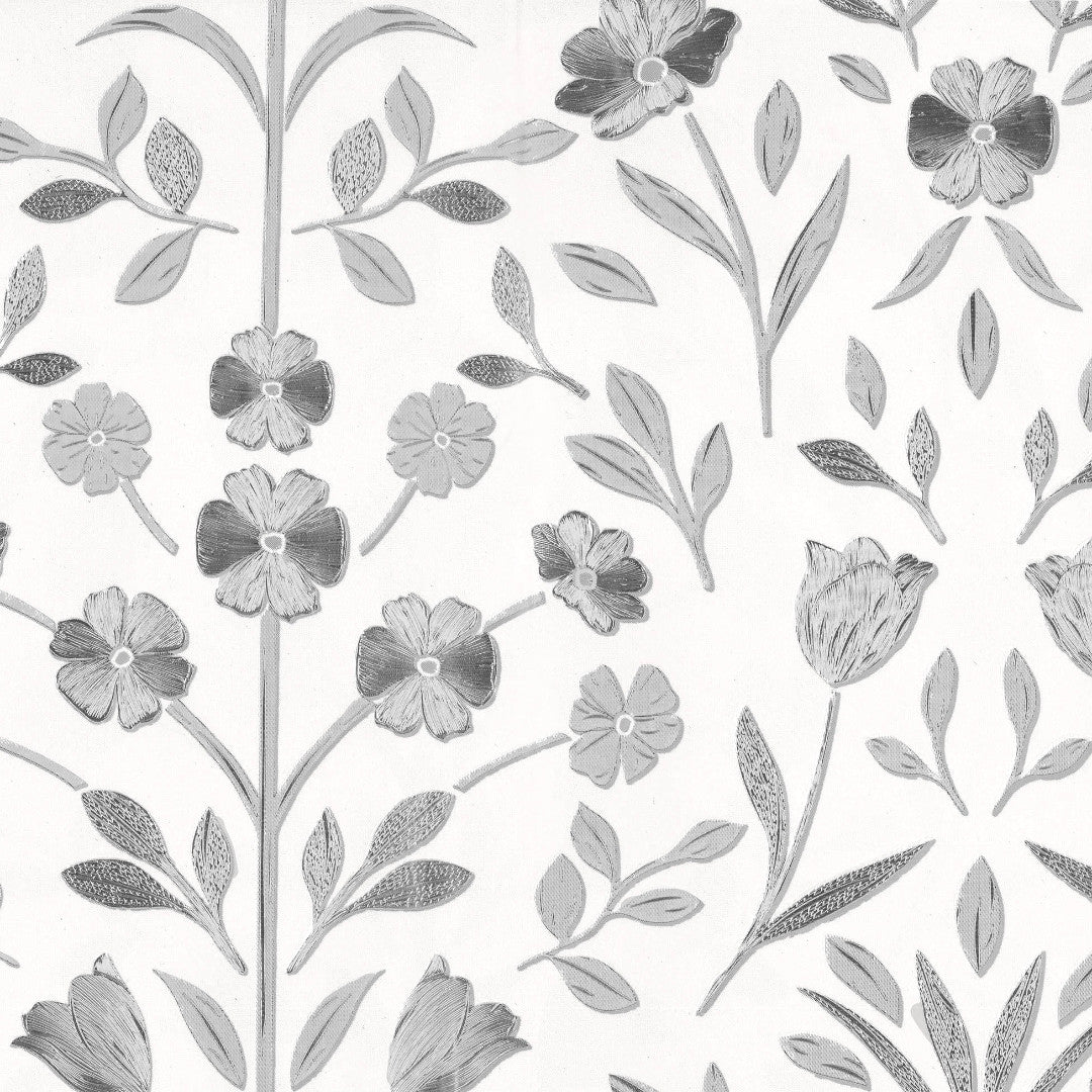 Nærbillede af prægede sølvblomster på voksdug