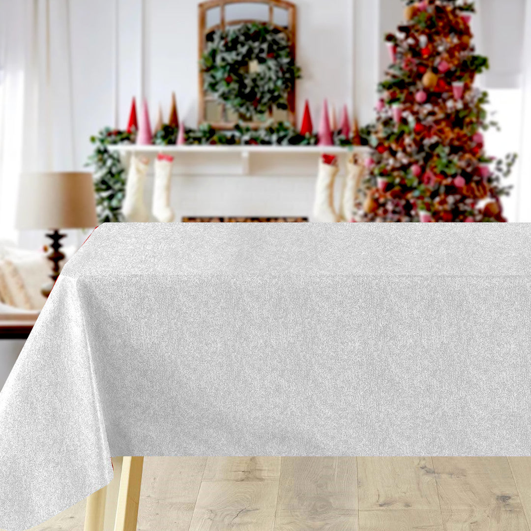 Sølvglans julevoksdug på bord, der reflekterer lys med en flot sølveffekt