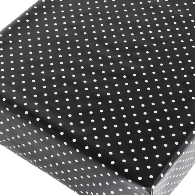 Voksdug med hvide prikker på sort bund