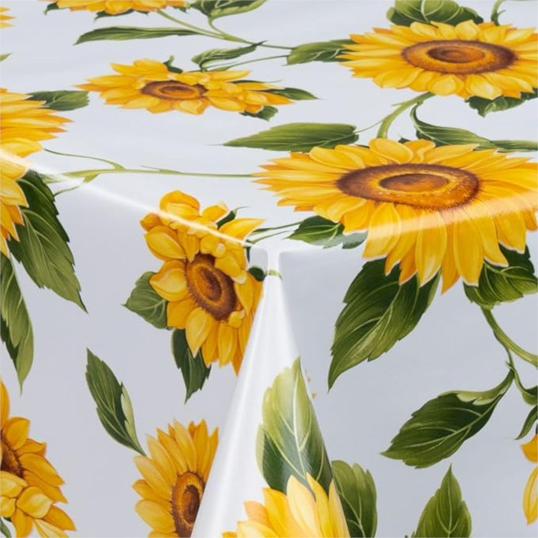 Solsikker - Voksdug i gule og orange farver på hvid bund, 140 cm