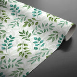 Agathe – Voksdug med bladmotiv i grønne nuancer, rullet