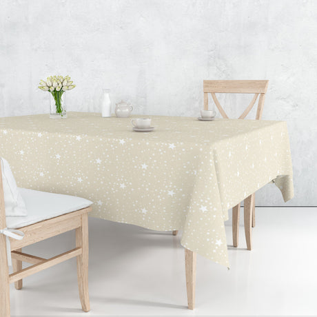 Etoiles Lys Beige julevoksdug på bord med hvide stjerner i stilrent design