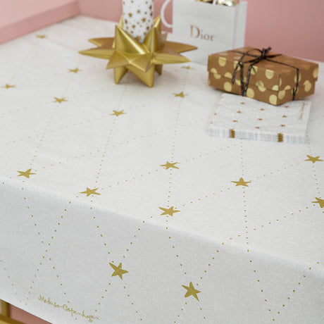 Medusa Stardust gold akryldug med antiskrid, flot Juledug med guld stjerner,